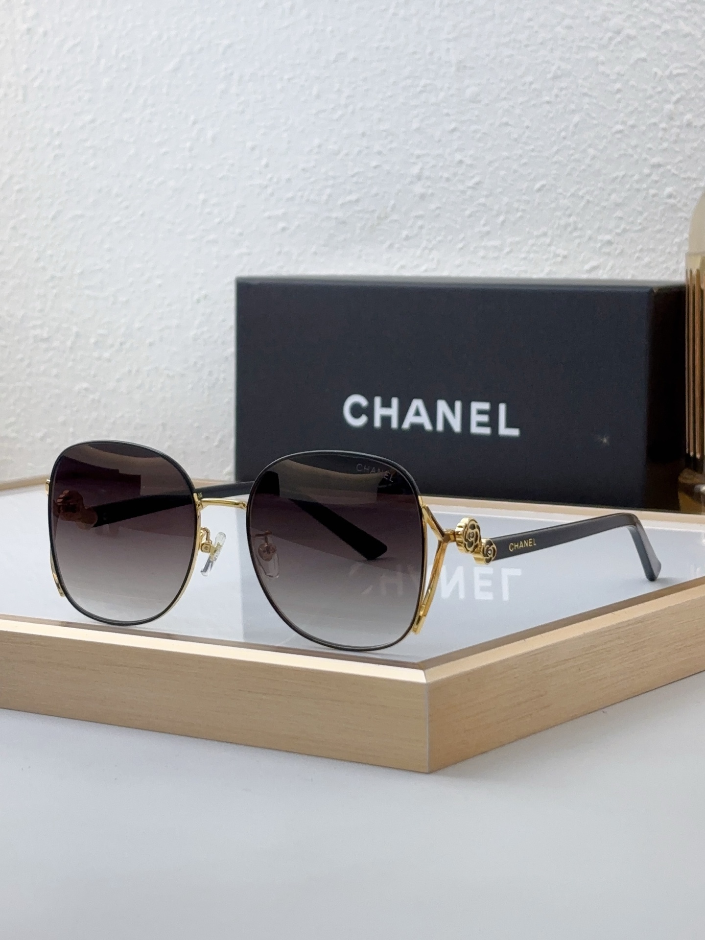 Chanel Round Sunglasses with Gold Camellia Accents & Gradient Gray Lenses (Model: CH5543)