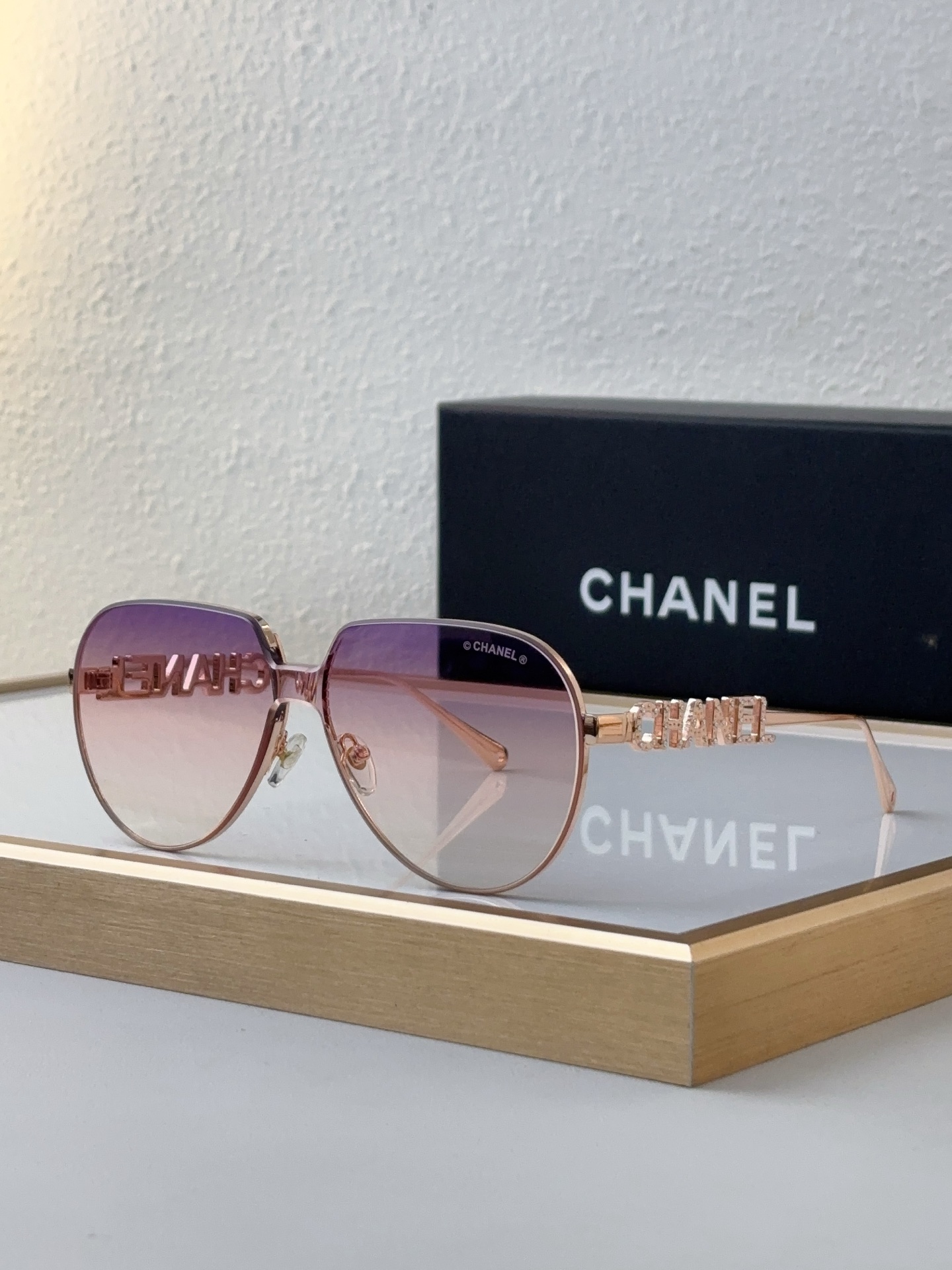 Chanel Rose - Gold Metal Aviator Sunglasses with Cut - Out "CHANEL" Motif (Model: CH5582)