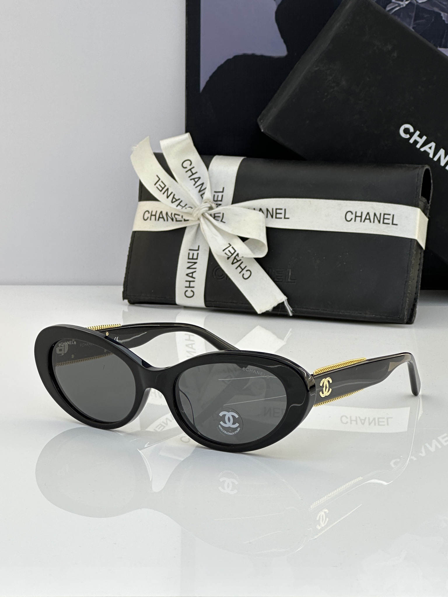 Chanel Black Acetate Oval Sunglasses with Gold - Chain & CC Motif (Model: CH5576)