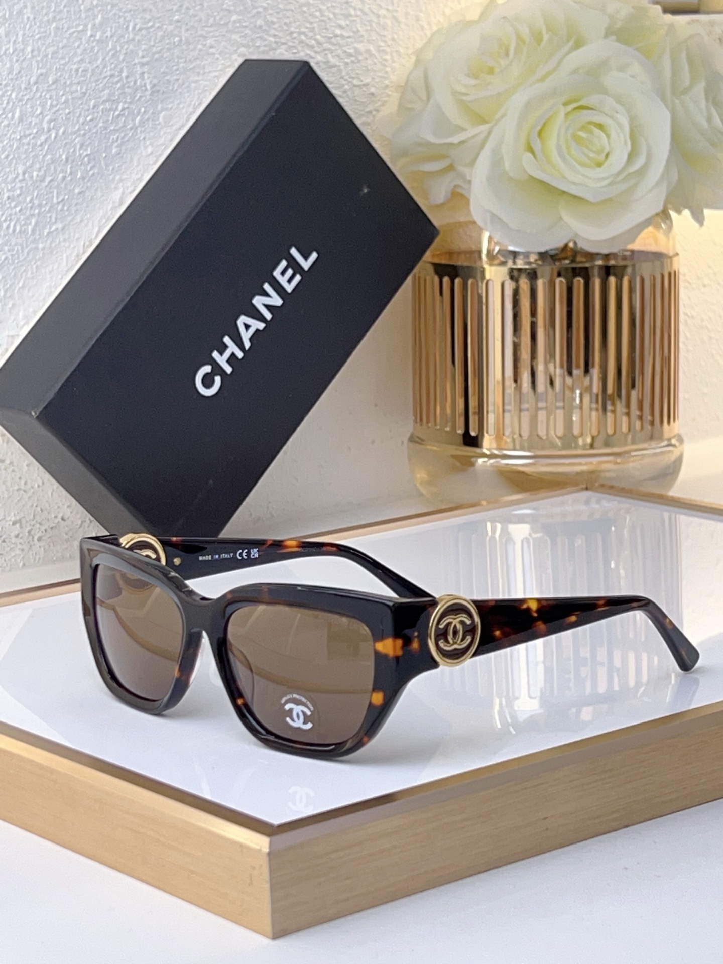 Chanel Black Acetate Cat - Eye Sunglasses with Gold - Tone CC Motif (Model: CH5574) Description