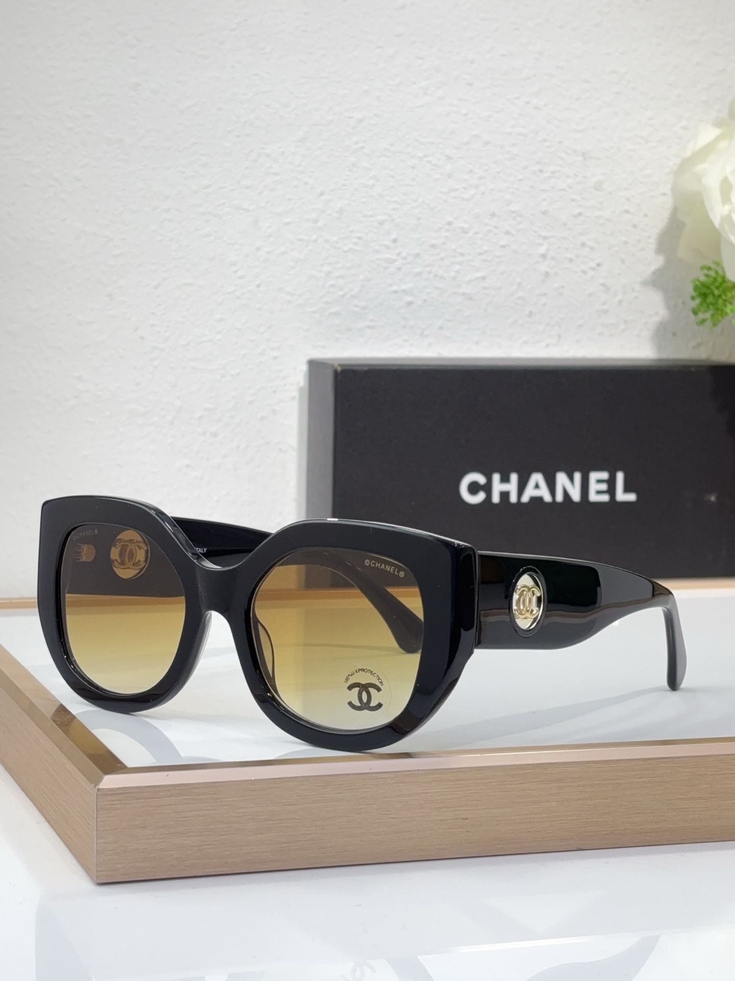 Chanel Black Acetate Oval Sunglasses with Gold - Tone CC Motif & Gradient Brown Lenses (Model: CH5542)
