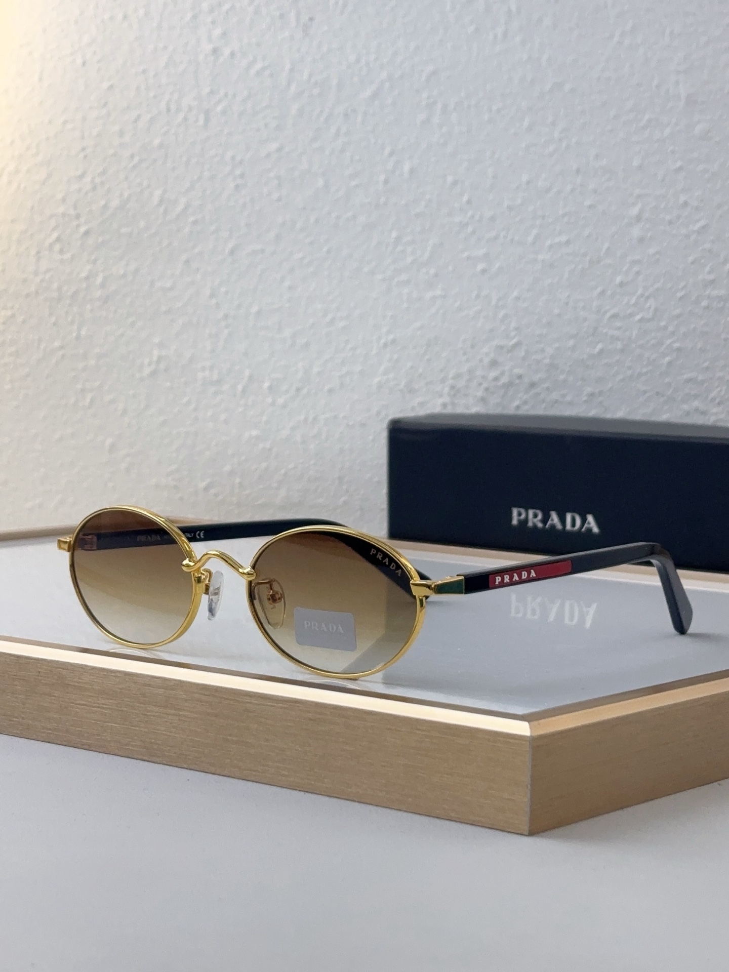 Prada Gold - Tone Metal Oval Sunglasses with Gradient Lenses (Model: PR14358S)