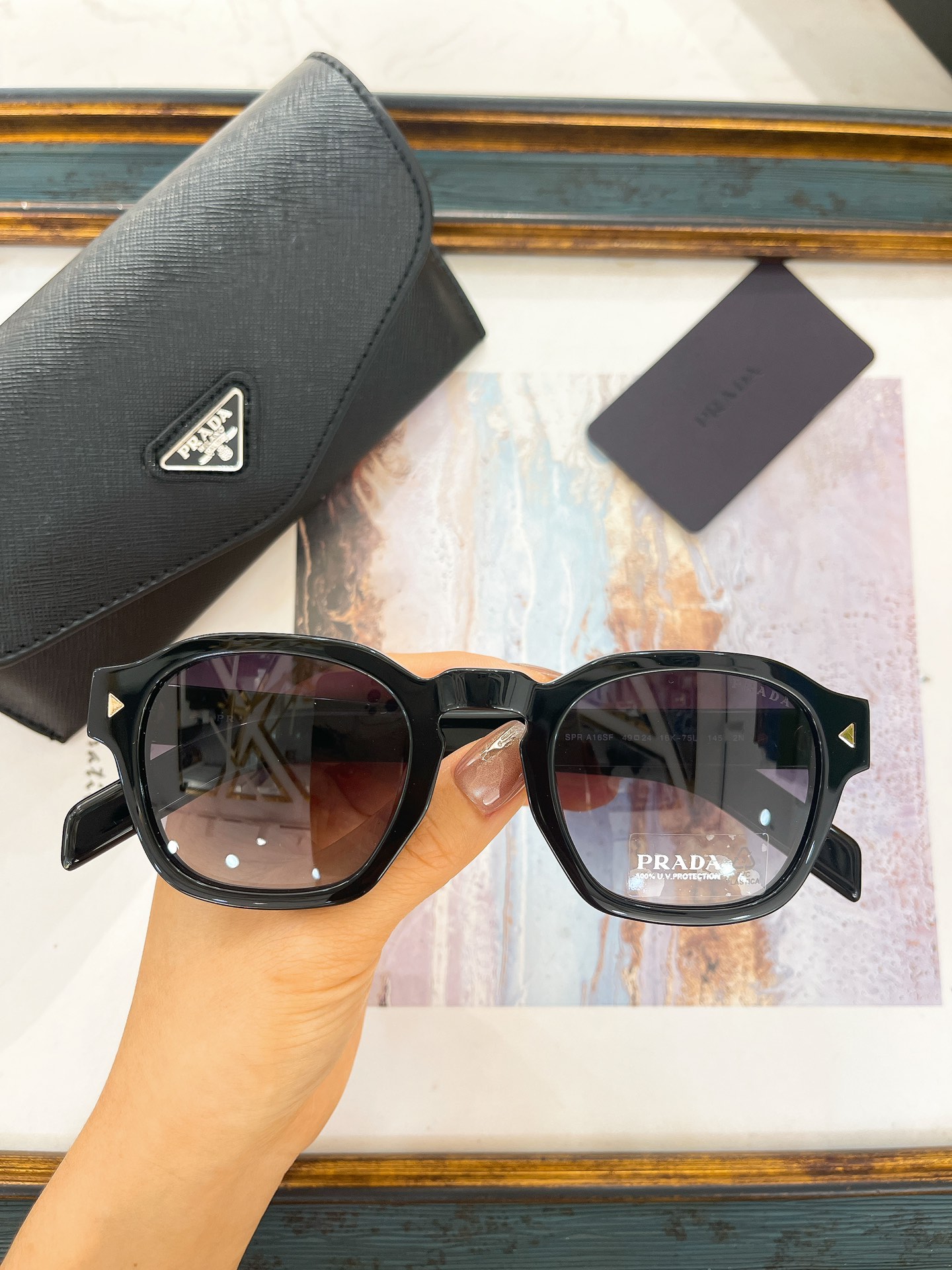 Prada Black Acetate Square - Round Sunglasses with Gold Accents (Model: PR14114S)