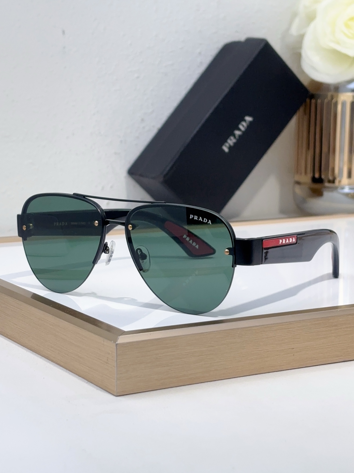 Prada Black Metal Aviator Sunglasses with Red & Gold Accents (Model: PR13947S)