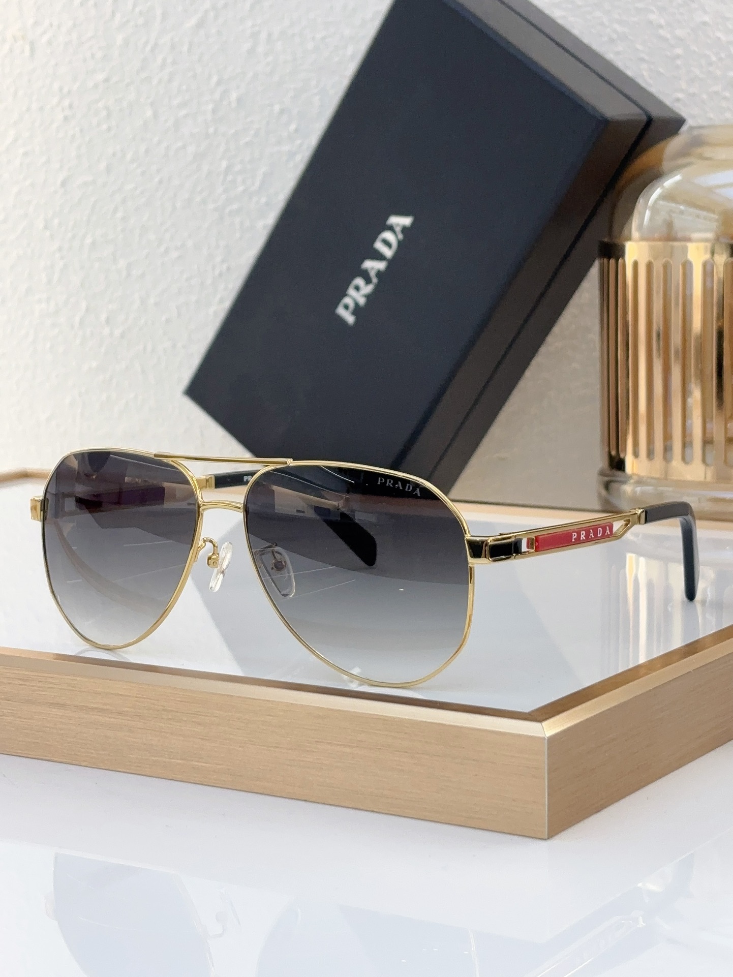 Prada Gold - Tone Metal Aviator Sunglasses with Red Accents (Model: PR13936S)