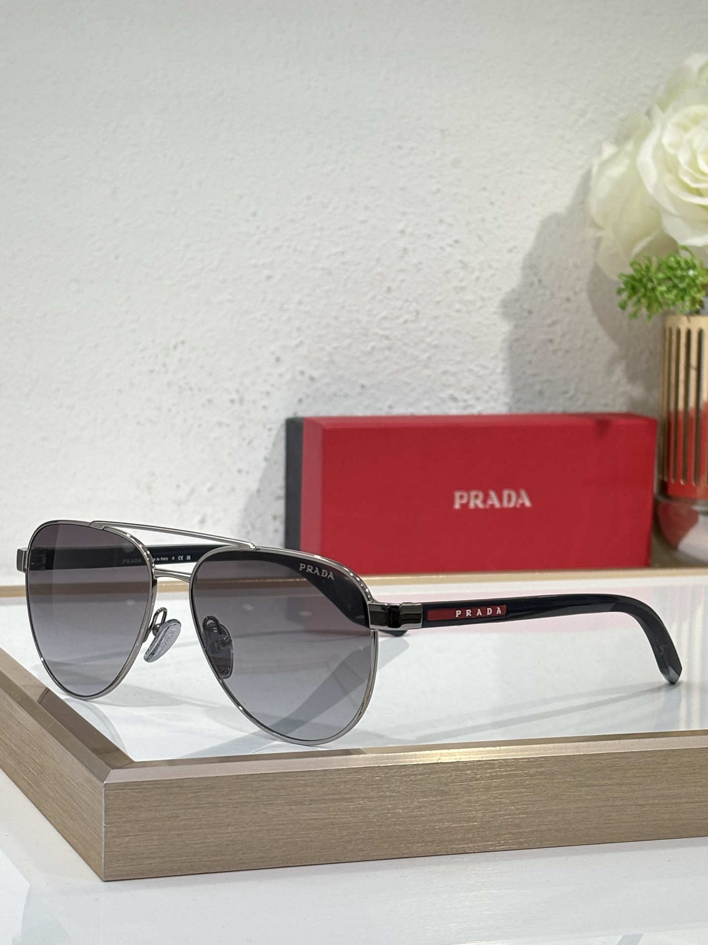 Prada Gunmetal - Tone Metal Aviator Sunglasses with Red Accents (Model: PR10903S)