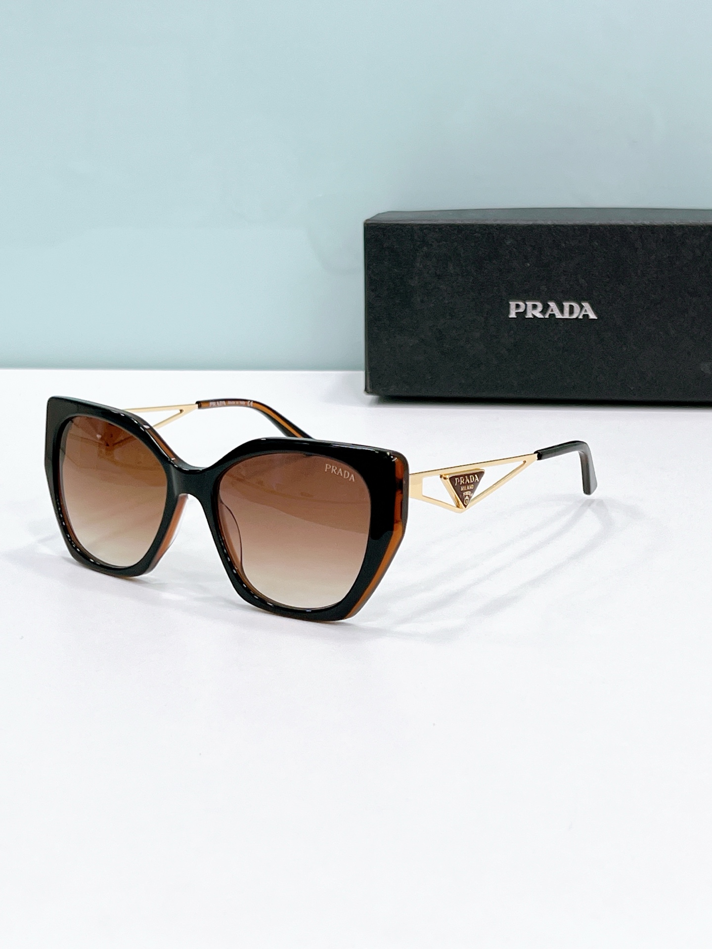 Prada Two - Tone Cat - Eye Sunglasses with Gold Accents (Model: PR3569S)