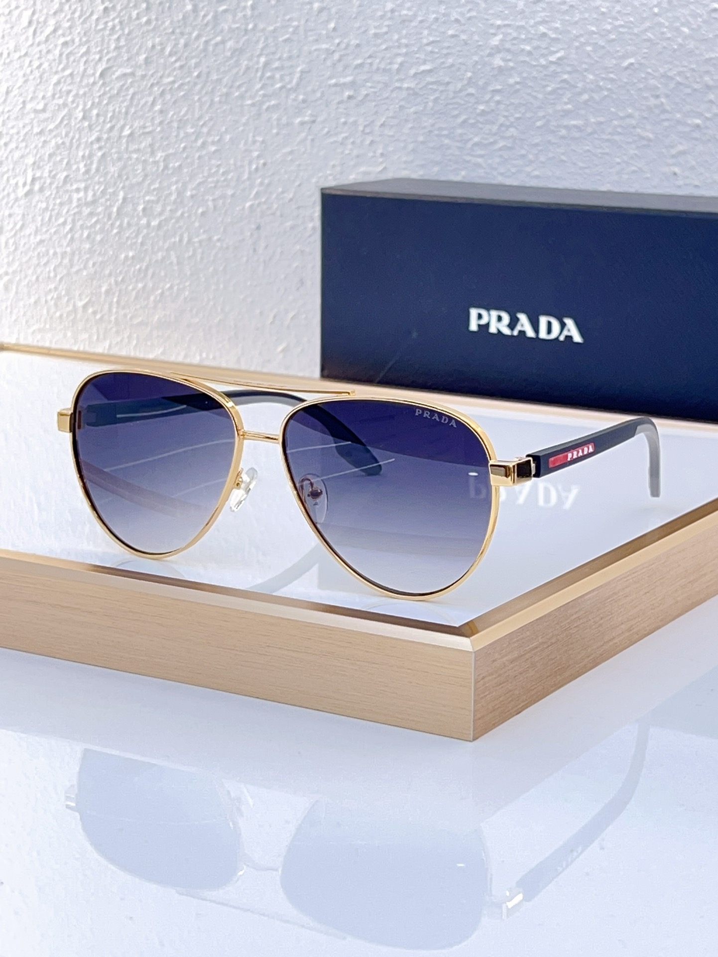 Prada Gold - Metal Aviator Sunglasses with Gradient Blue Lenses (Model: PR7777S)