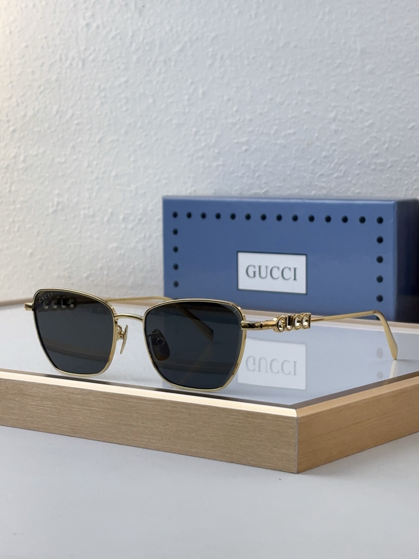 Gucci Rectangular Gold - Tone Metal Sunglasses with Crystal - Embellished Temple Accents & Dark Gray Lenses (Model: GG1281S)
