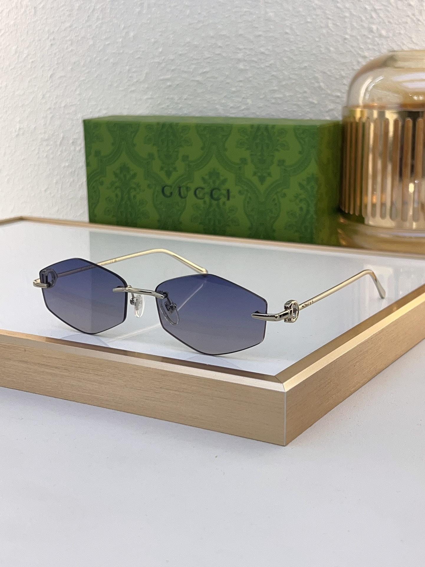 Gucci Hexagonal Rimless Gold - Tone Metal Sunglasses with Chain - Linked Temple Accents & Gradient Blue Lenses (Model: GG1253S)
