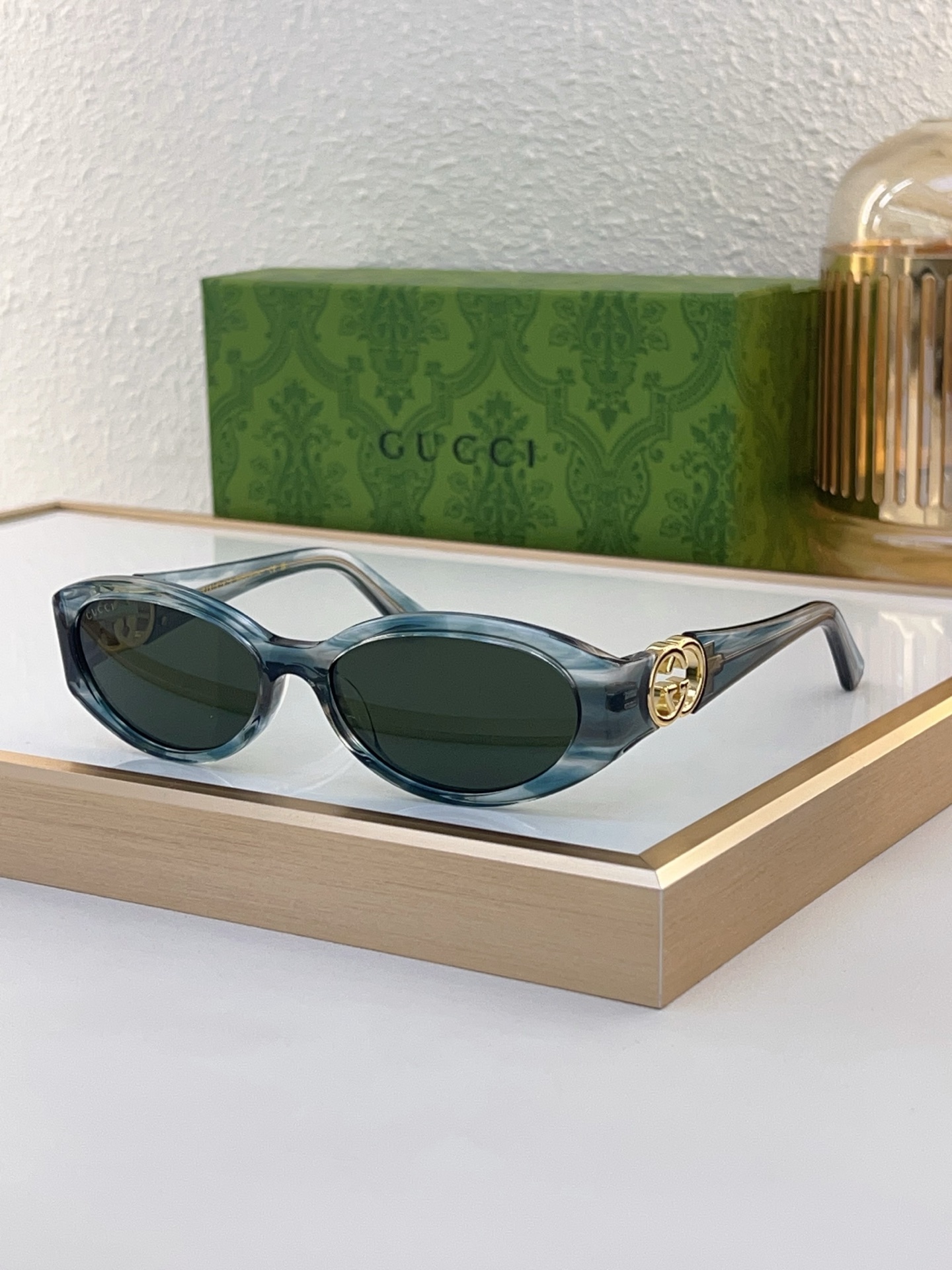 Gucci Oval Blue - Gray Marbled Acetate Sunglasses with Gold - Tone Double G Accents (Model: GG4400S)