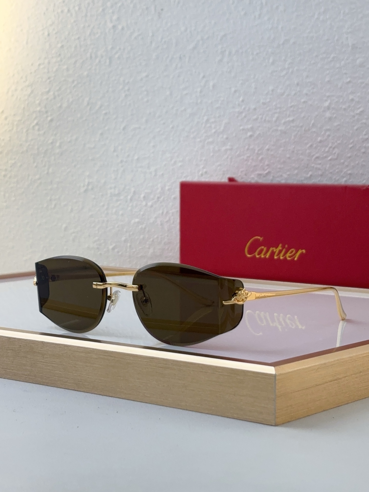 Cartier CT0652S Rimless Oval Sunglasses with Silver Metal Accents & Gradient Gray Lenses