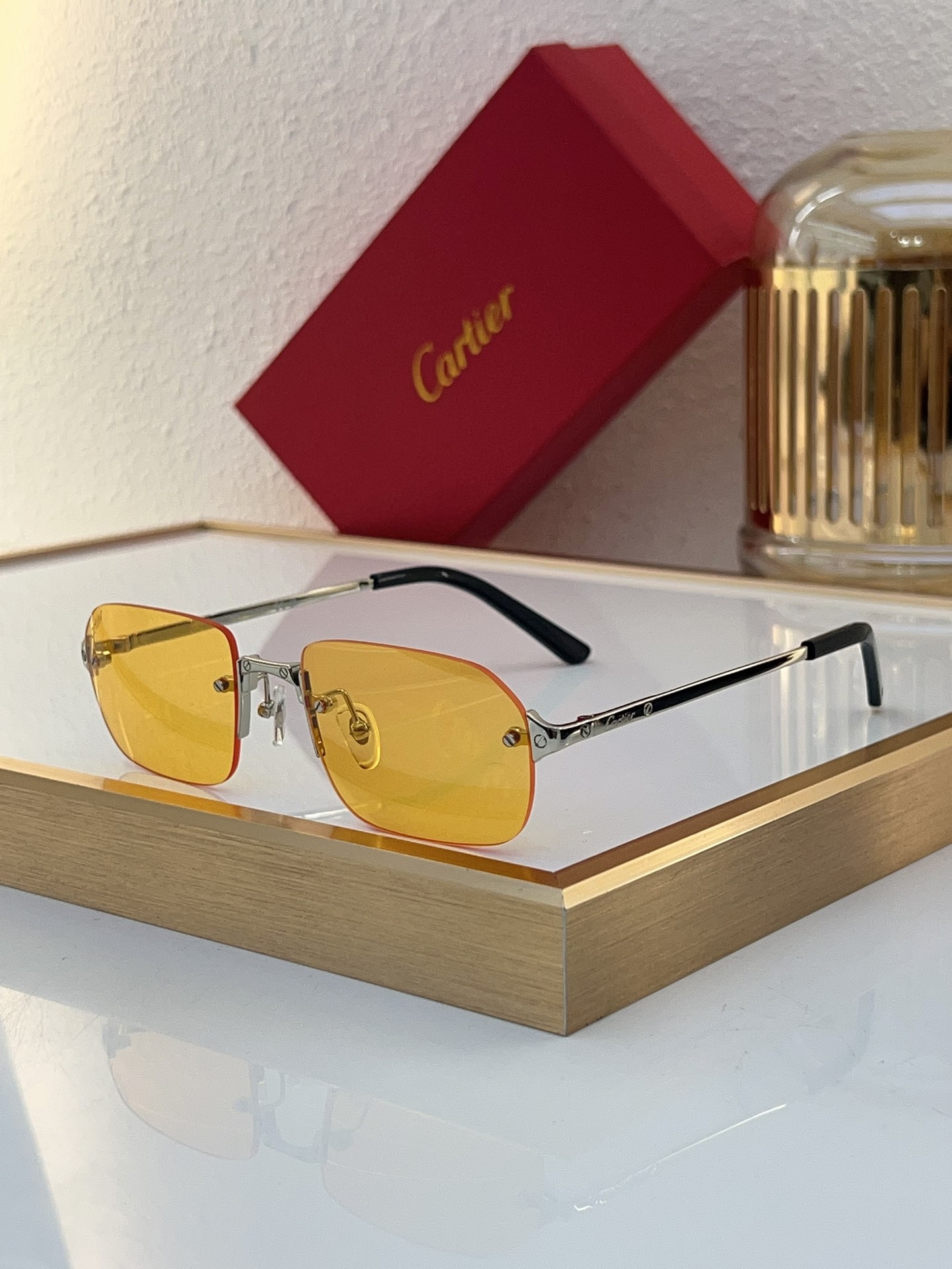 Cartier CT0460S Yellow Lens Silver Rimless Sunglasses