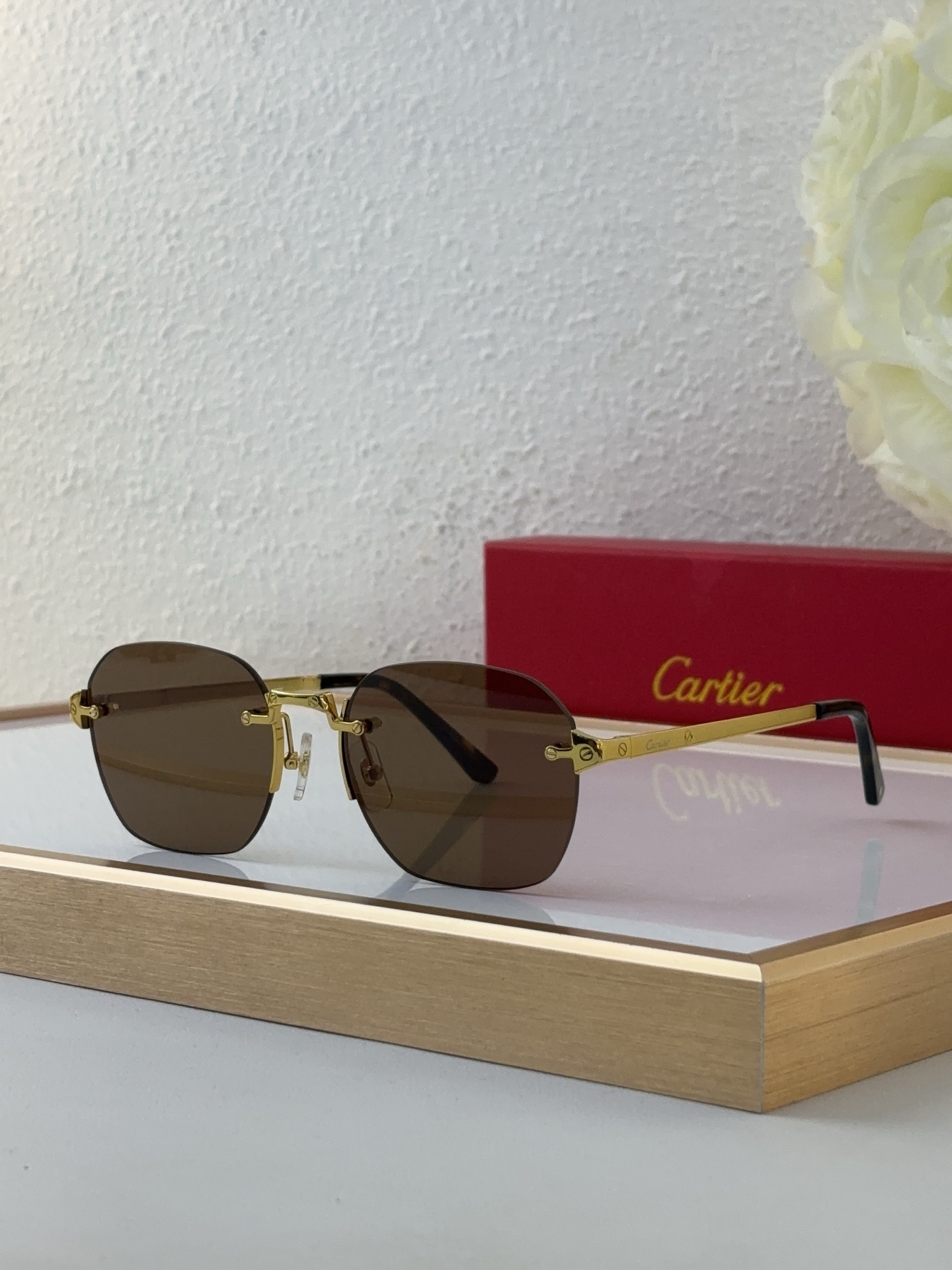 Cartier CT0459S Green Lens Silver Rimless Aviator Sunglasses