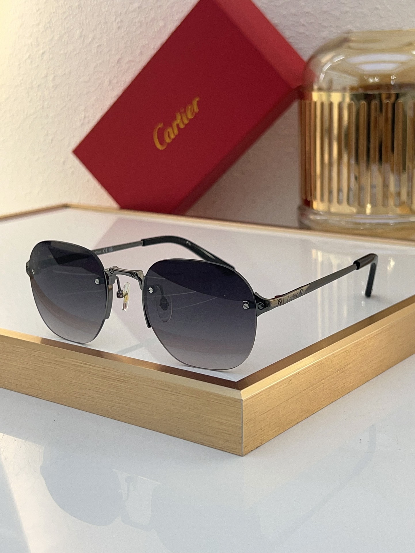 Cartier CT0459S Green Lens Gold Rimless Aviator Sunglasses