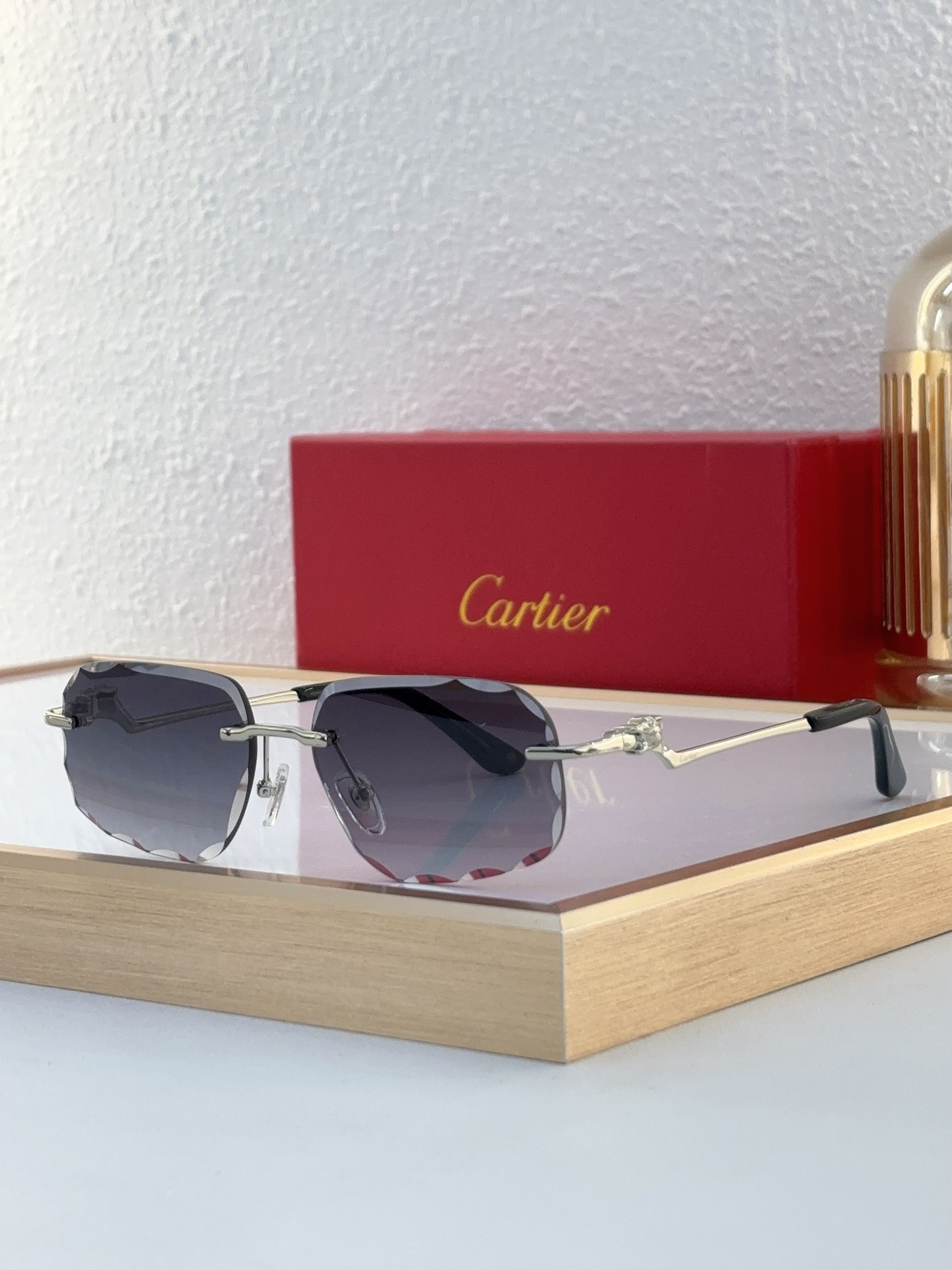Cartier CT0058O Amber-Tinted Sculpted Rimless Sunglasses
