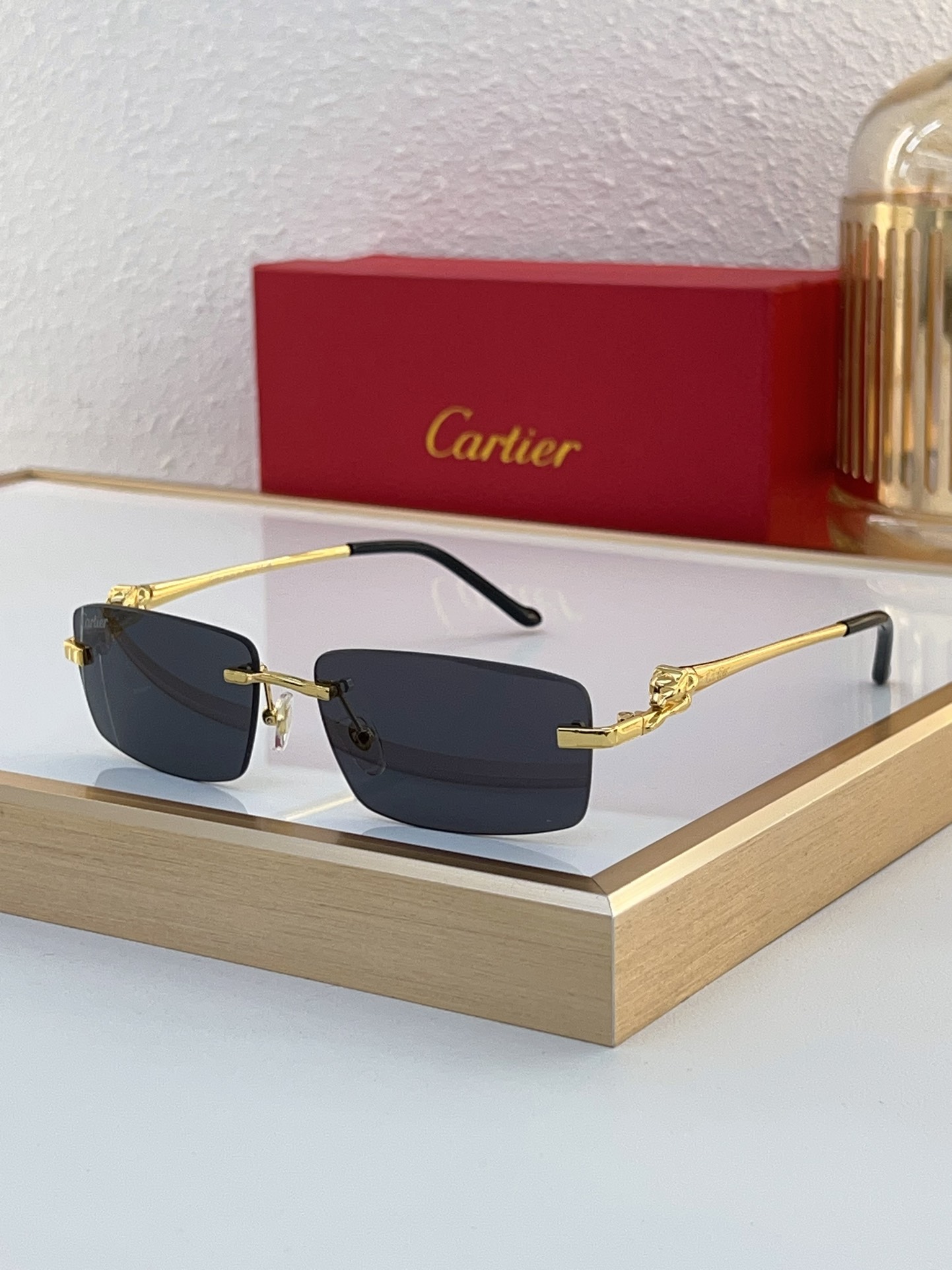 Cartier CT0430S Panther Motif Rectangular Rimless Sunglasses