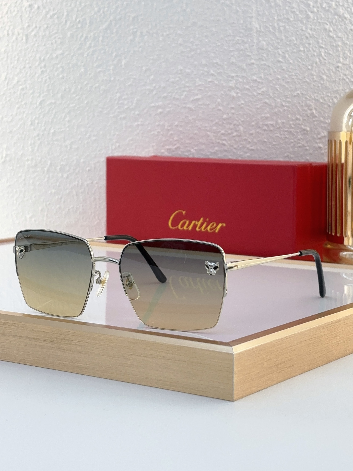 Cartier CT0333S Panther Décor Rectangular Rimless Sunglasses