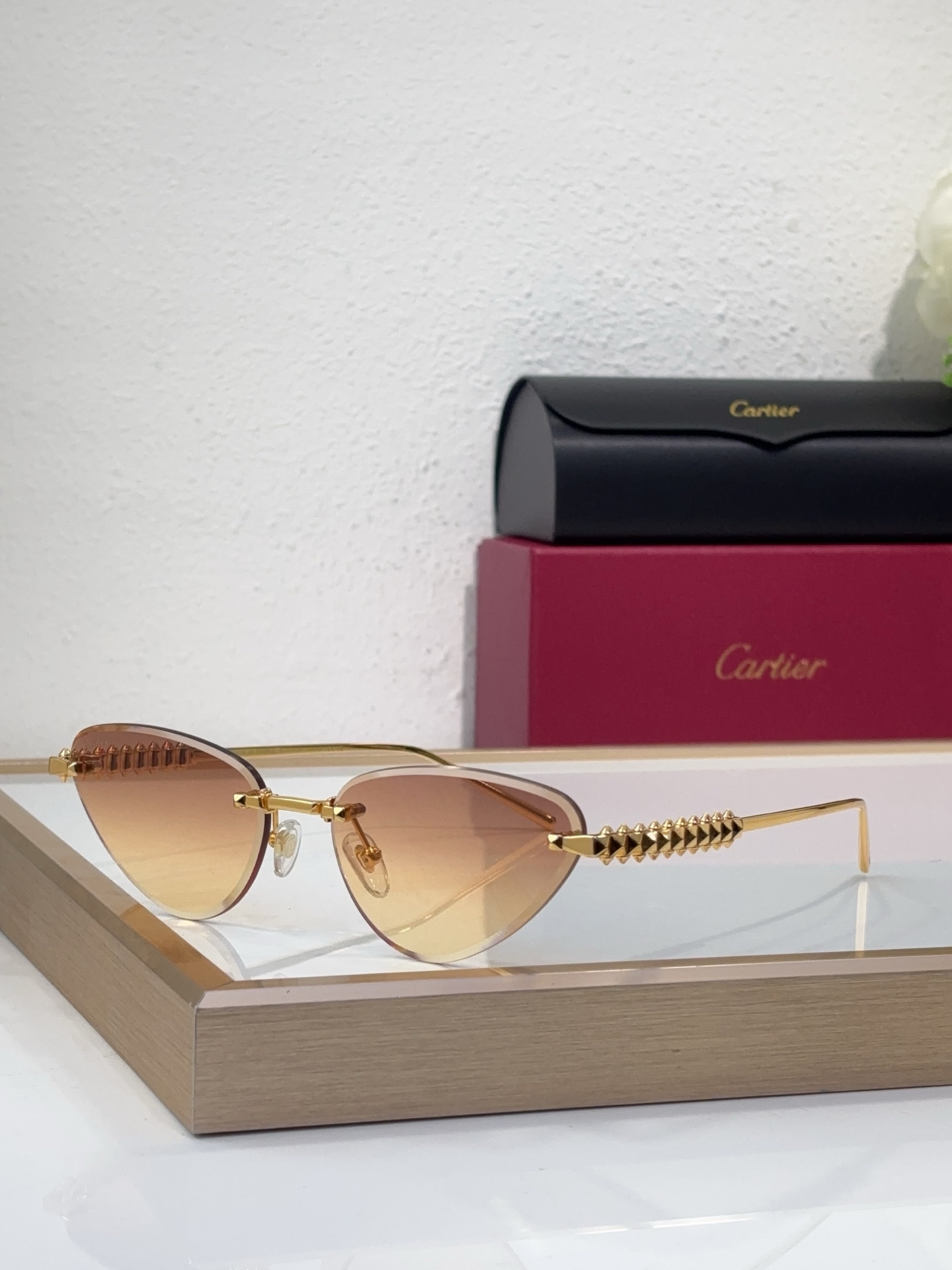 Cartier CT0689S Pyramid-Studded Cat-Eye Rimless Sunglasses
