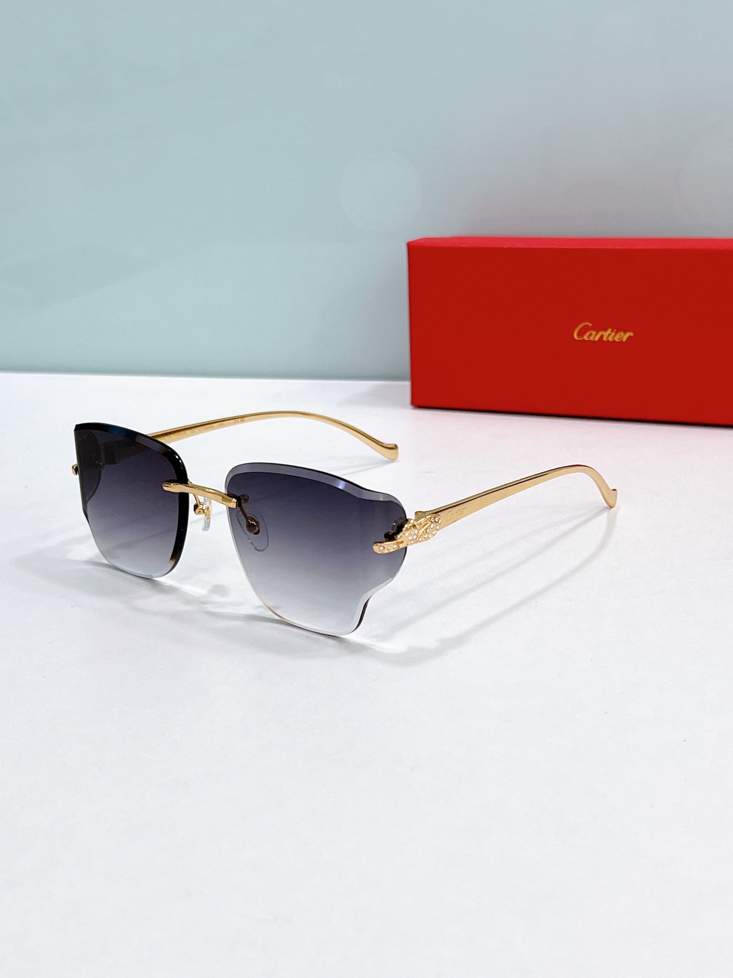 Cartier CT0546S Panther-Embellished Rimless Sunglasses
