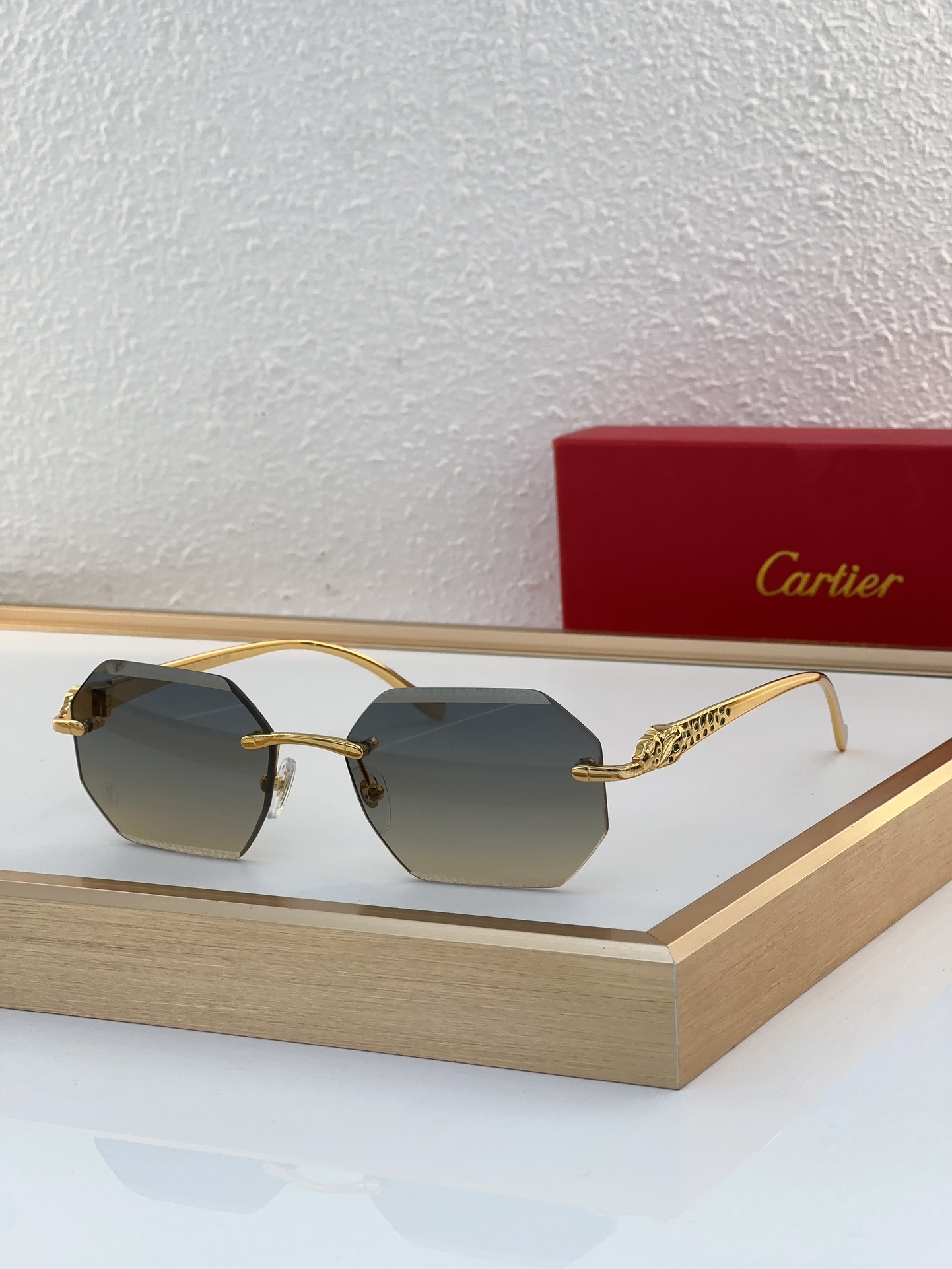 Cartier 0524 Panther-Engraved Geometric Rimless Sunglasses